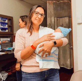 Women holding a infant child
